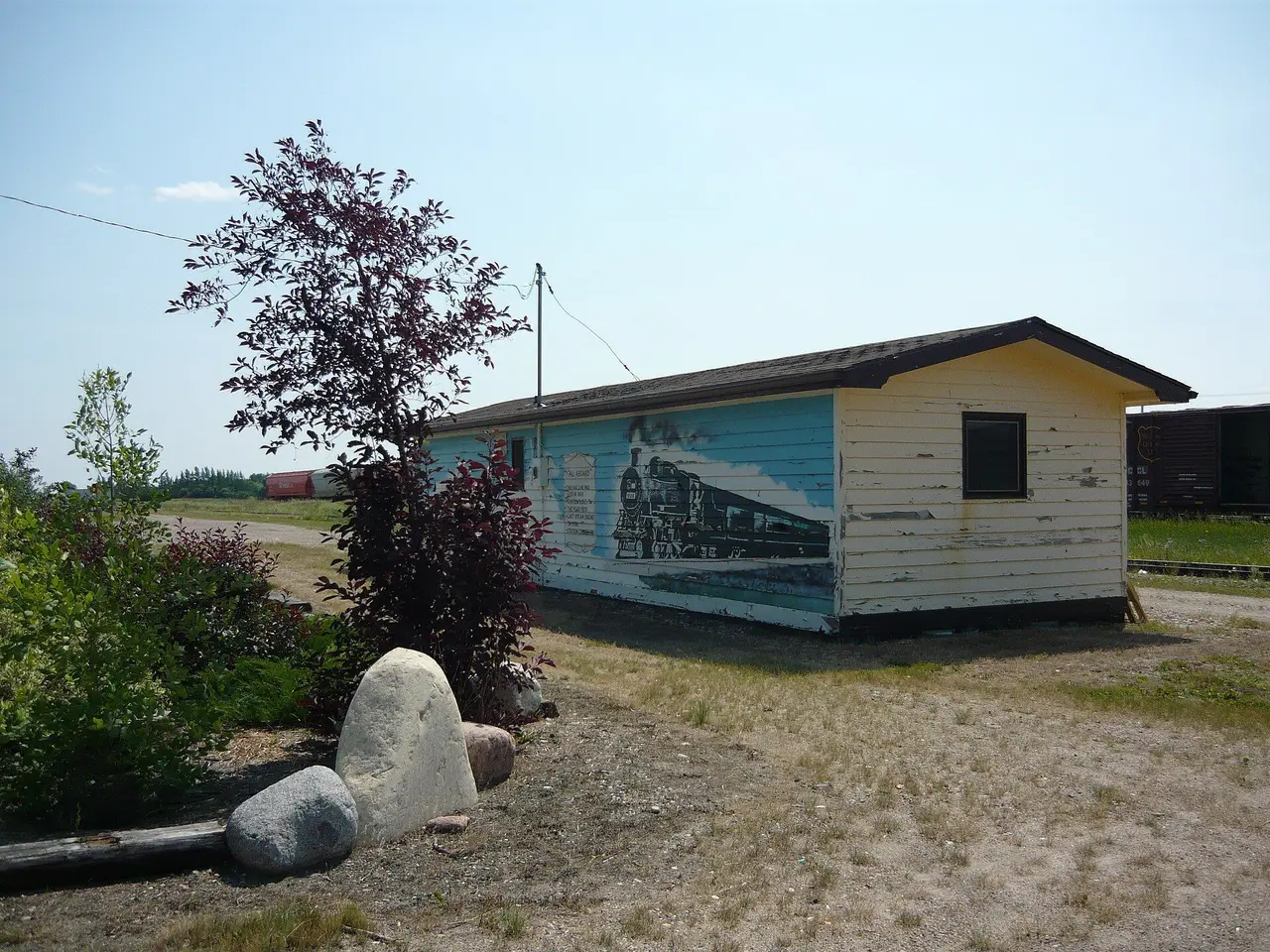 Old railway station with train mural, 2009
